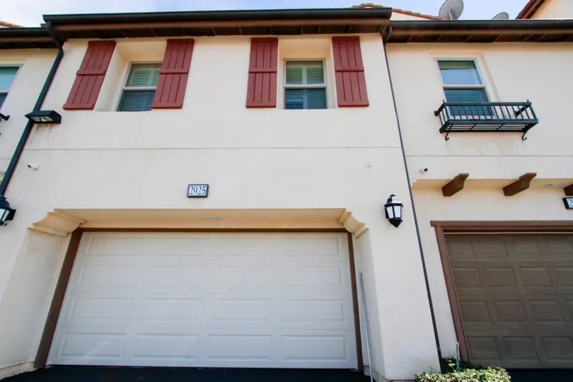 wall have number 2925 and garage in front of the building in Avenue E