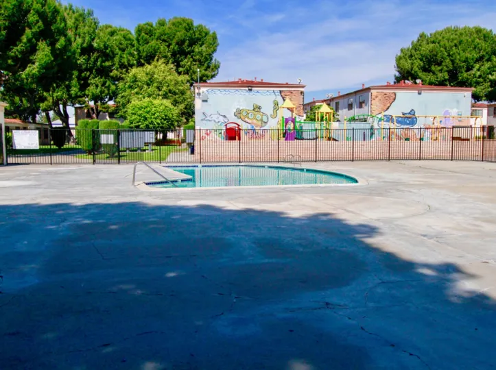 An empty swimming pool on a sunny day in the Bishop Manor community