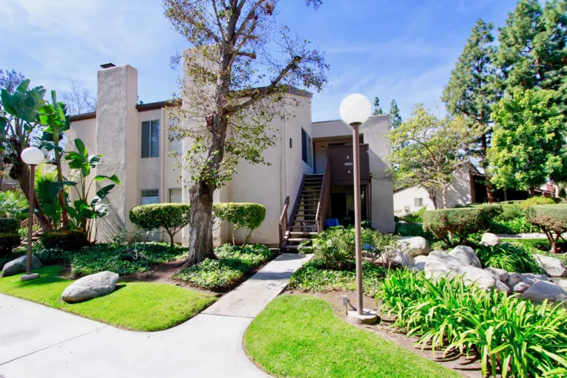 A beautiful day in the Cabrillo Park in front of a house and garden.
