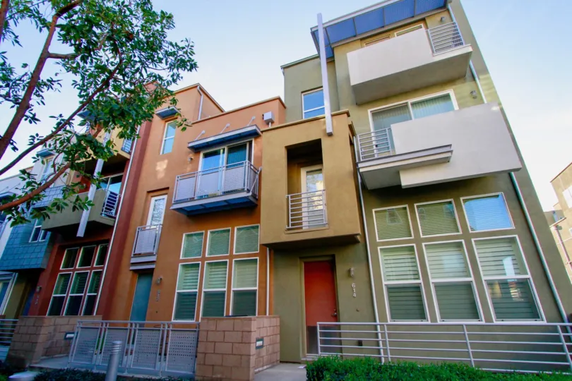 A orange and tan apartment building in City Place on a sunny day