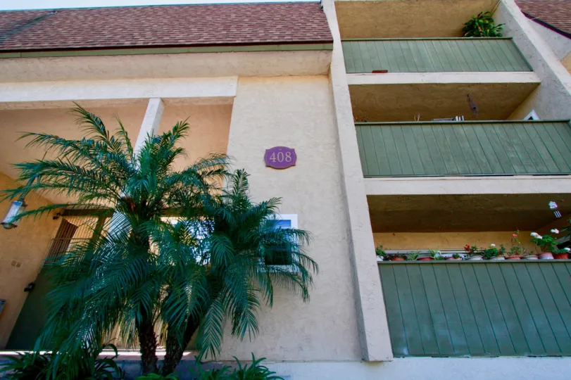 Trees in front of the building entrance in French Park Condos