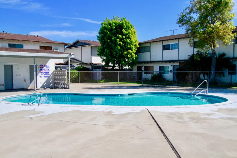 A great day in the Garden Villas with a pool and trees.