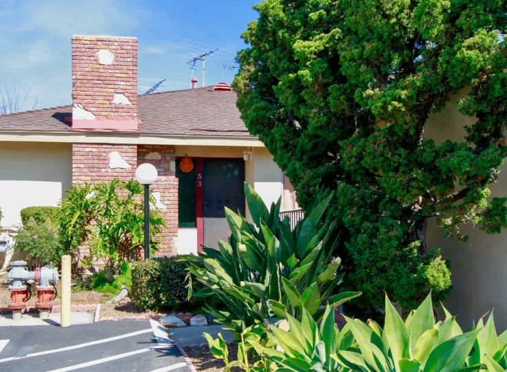 At the door, the number 53 is marked with trees, light lamps and bushes in Hillview Regency