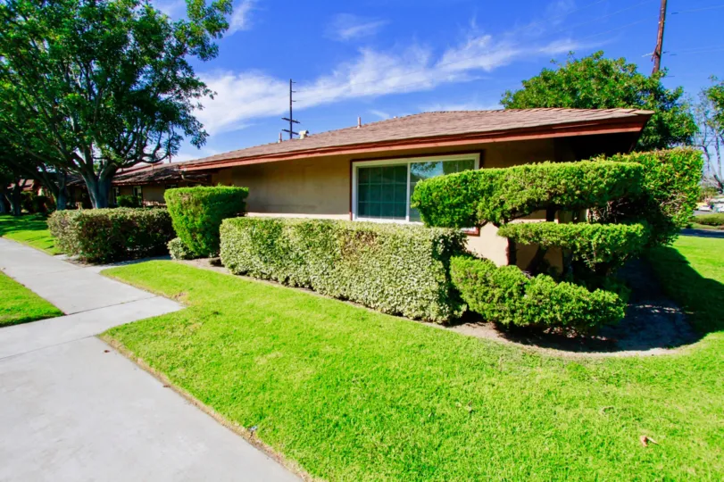 plants and trees around the building in La Linda Villas
