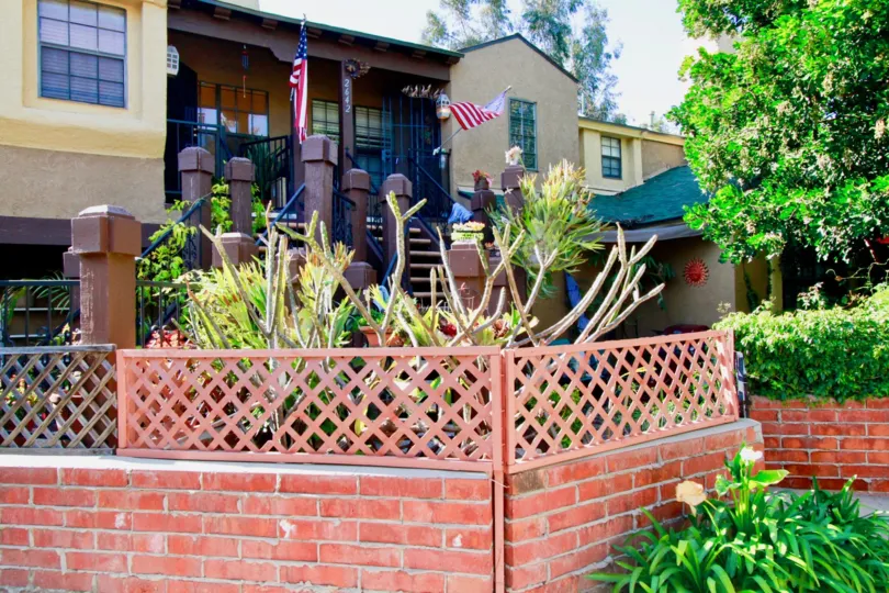 flag and plants and garden in front of the house in Los Quatros Condos