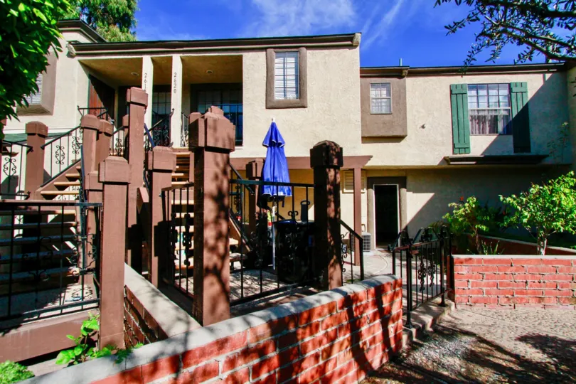 A large bunglow with a staircase leading upto the first floor porch in the Los Quatros condos community