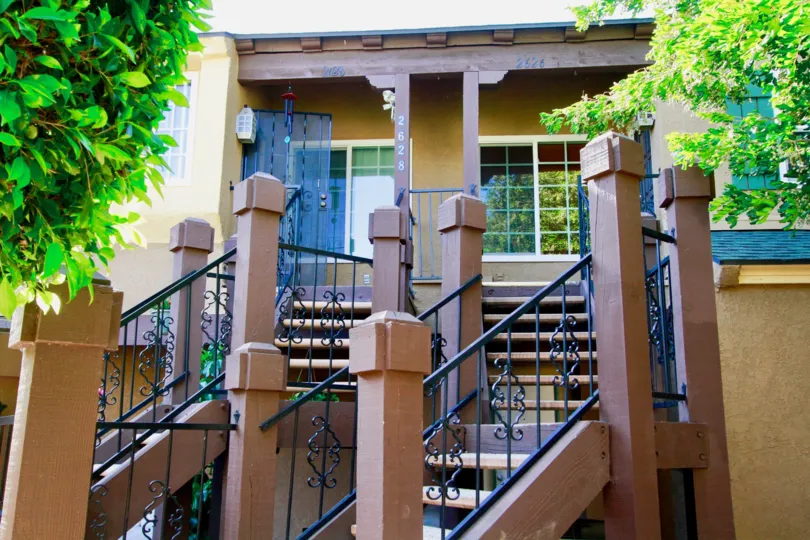 Stairs in the Los Qiuatros Condos community with trees