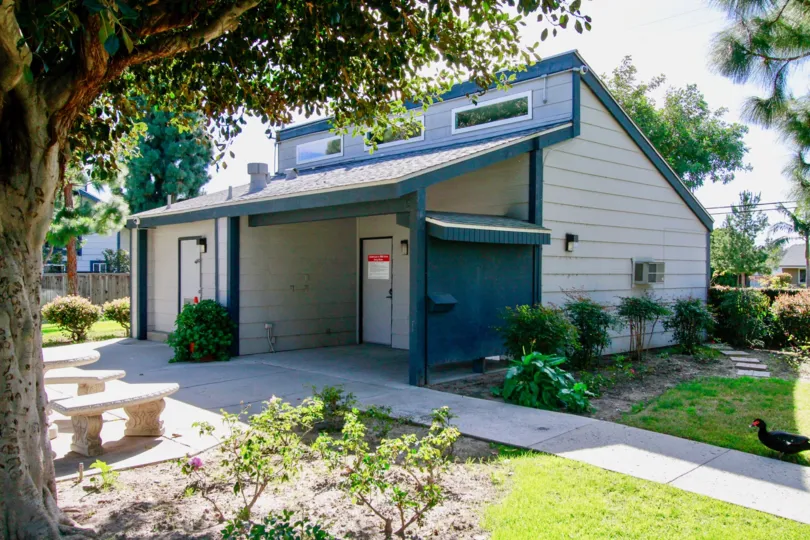 A small house with sloped roof surrounded by a garden in the Mountain view community