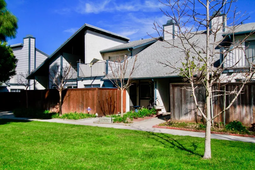 An architectural beauty with sloped roof with a lawn in the Mountain view community in Santa Ana