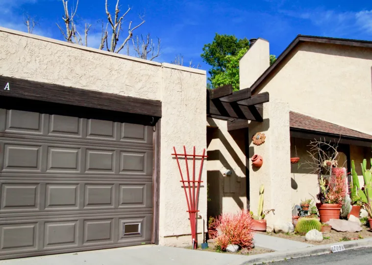 A house with chocolate and cream exteriors with a large garage in the Park glen community