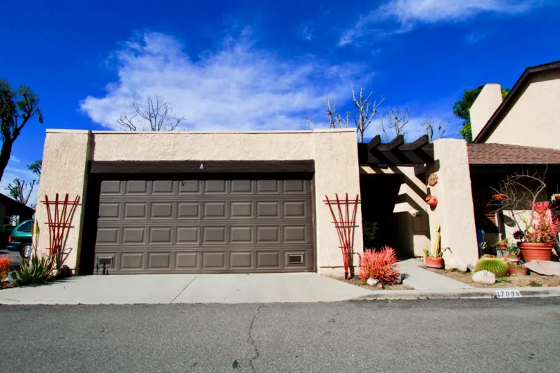 A view of a large garage door of an elegantly built bunglow in the Park Glen community