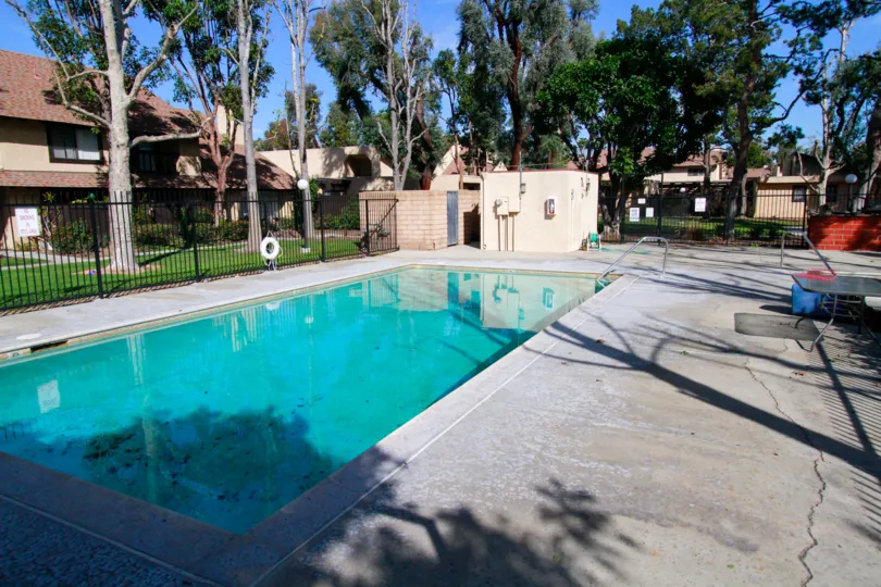 swimming pool decorated with chairs and plants around in Park Glen