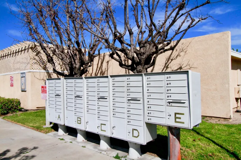 Many postal boxes are fixed at the pathway in Sandalwood Village which is named by alphabets