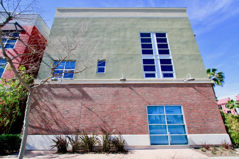trees and plants around the building in Santiago Street Lofts