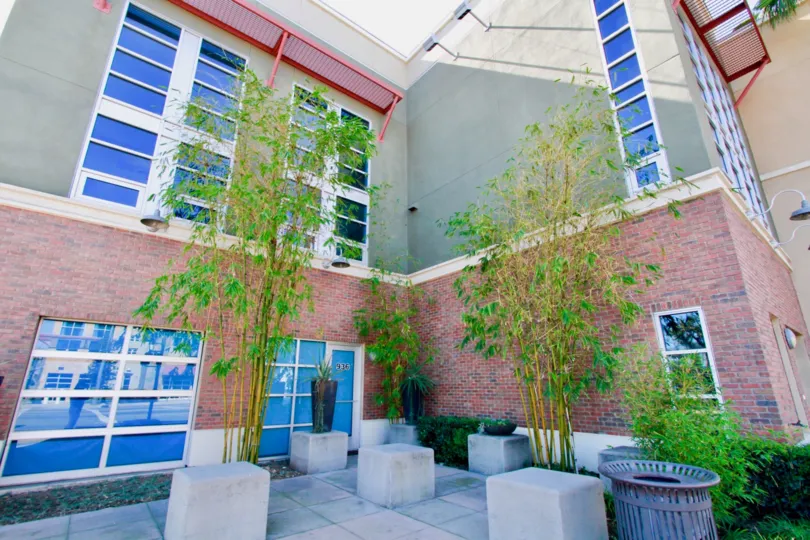 A corner of a large bunglow with flower pots inside the Santiago street lofts community