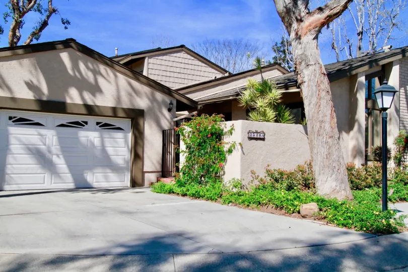 clean and clear area view in front garage near house having trees and plants around in Shady Hollow
