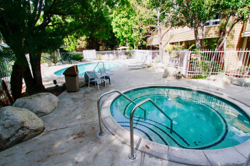 South Coast Springs Santa Ana viewed like natural forest effect with round shape pool and stone bench