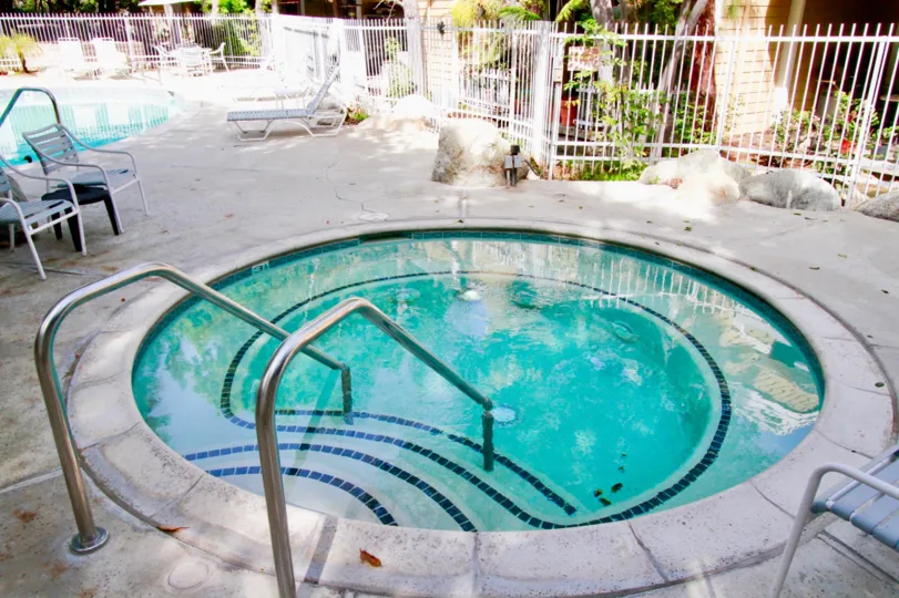 Children swimming pool is available in the apartment of South Coast Springs with trees and chairs
