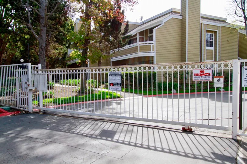 A sunny day in the South Coast Springs with in front of the gate and sign.