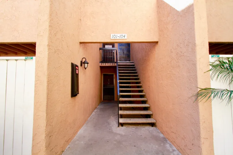 A beautiful day in the South Coast Villas in front of a staircase.