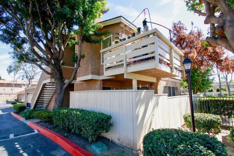 A home in the Summer Green community with a fence and staircase.