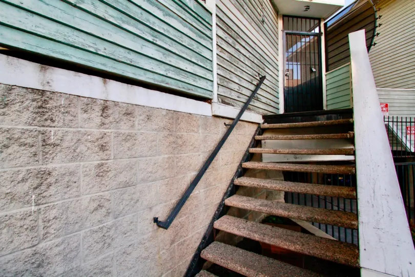 A beautiful day in the Sunwood Square with steps to an entrance.