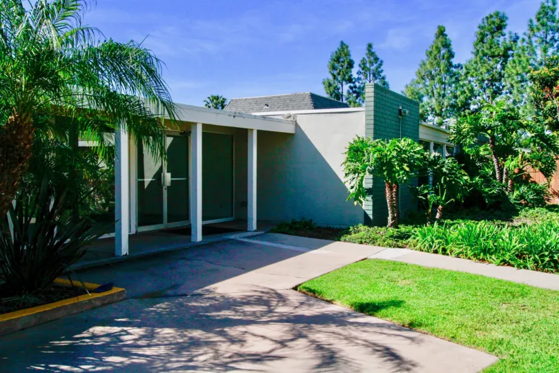 An elegantly designed house with a wide front door and large front yard in the Tennessean community