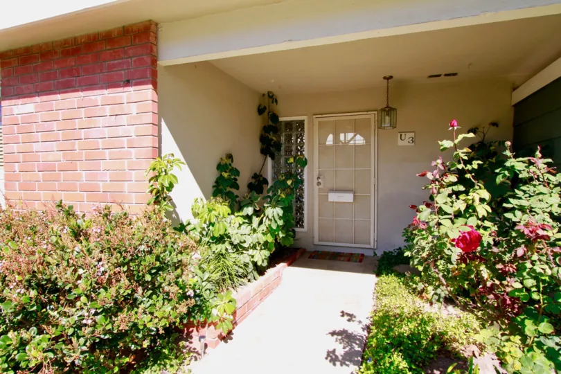A beautiful day in the Tennessean in front of a house with flower.