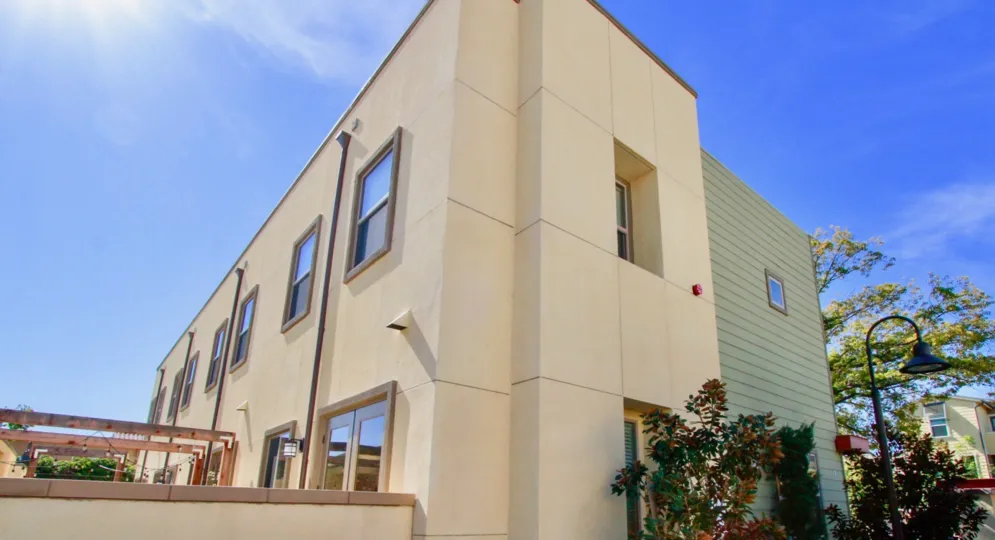 A large residential complex with multiple windows inside the Lacy collection community