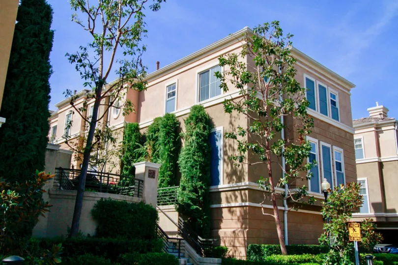 Vantage Santa Ana California biscuit color buildings tall trees to their heights and plants too