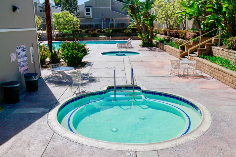 A nice day in the Village Walk with a small blue pool.