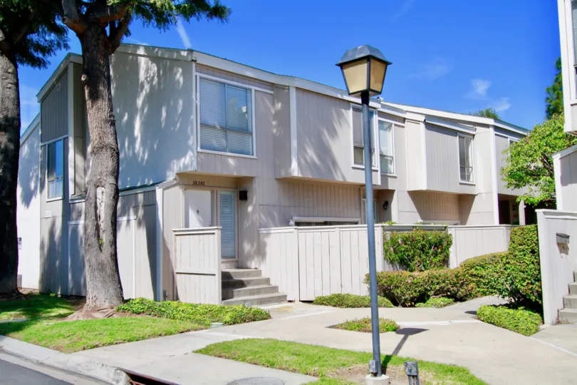 Village Walk Santa Ana California with neat step stones, light and square shaped grass platform around trees