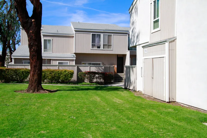 Freshly mowed green lawn in front out housing area in Village Walk community.