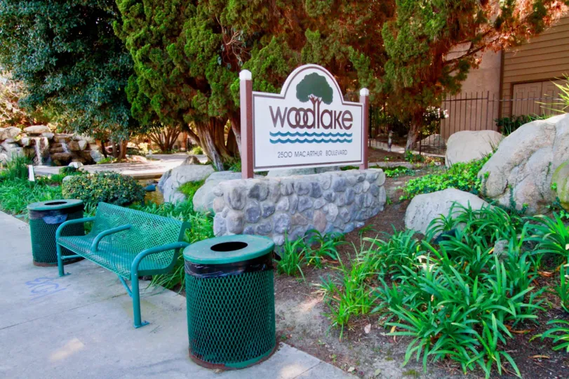 Woodlake Santa Ana California resembles as park for children with different green shades in trees, benches, leafs