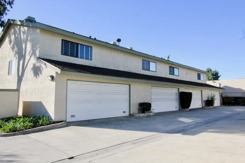 Walk path to the building and more car parking areas in Cerritos Gardens.