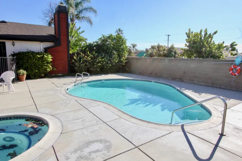 Sunny summer morning at the pool with adjacent unit at the Chapman Villas