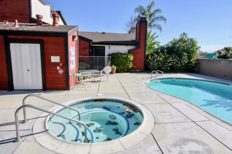 THE RED COLOUR HOUSE INK THE CHAPMAN VILLAS WITH THE SWIMMING POOL, CHAIRS