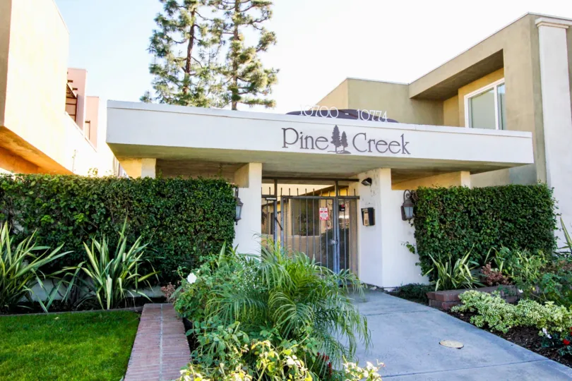 Front view of Pine Creek with nice garden and wall plants.