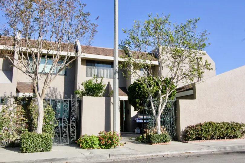 THE HOUSE IN THE STANTON PARK TOWNHOMES WITH THE GATE, PLANTS, TREES