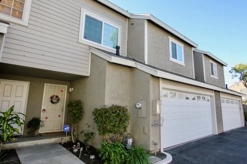 A huge building with grey color walls and glass windows and slanting roof in Western Meadows.