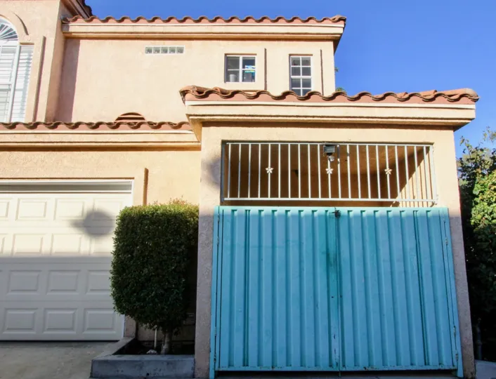 A car porch with a gate in the Willowbrook Terrace.