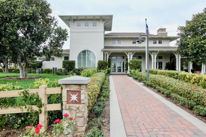THE HOUSE IN THE Ainsley Park WITH THE PATHWAY, FLAG, LIGHT, PLANTS, TREES
