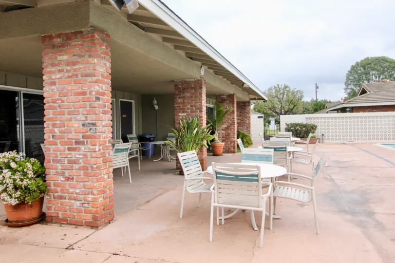 Brick columned patio at poolside of home in Broadmoor Park.
