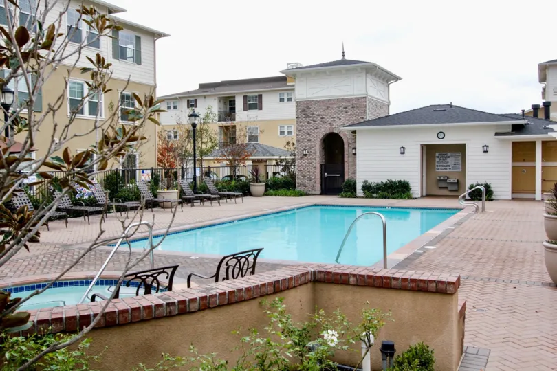 The swimming pool area in the multi family housing community of Cambridge Lane in Tustin California