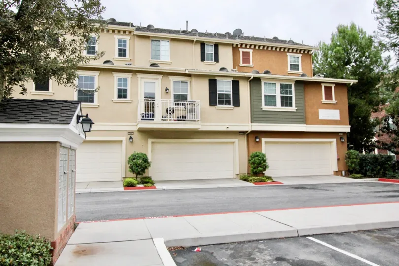 An overcast day in the Camden Place apartments complete with garages and walking areas