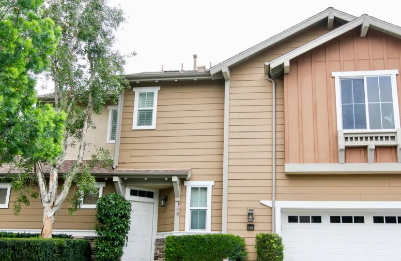 A white door sits on an angle of a townhome in the Lindy Crossing community