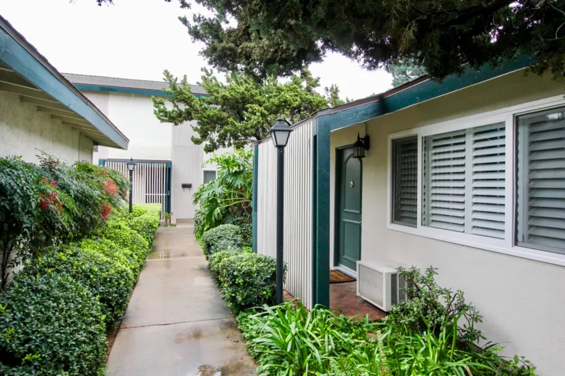 the palmwood gardens is a greenish house of the tustin city in california