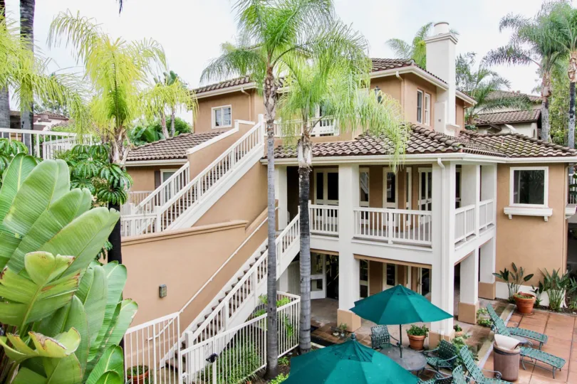 A three-storey clubhouse with exterior staircases in the Rancho Veracruz community.