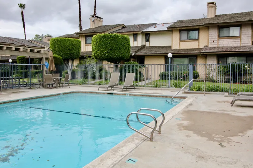 THE BUNGALOW IN THE SAN JUAN MEADOWS WITH THE SWIMMING POOL, CHAIRS, PLANTS, TREES, GRASSLAND