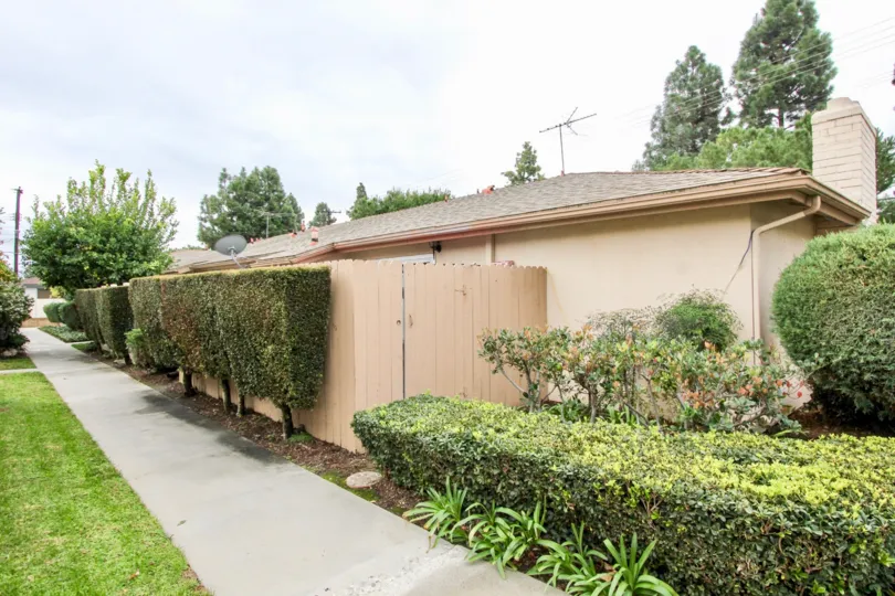 Fabulous lawn everywhere around a villa with antenna on top in Tustin Park Villas of Tustin